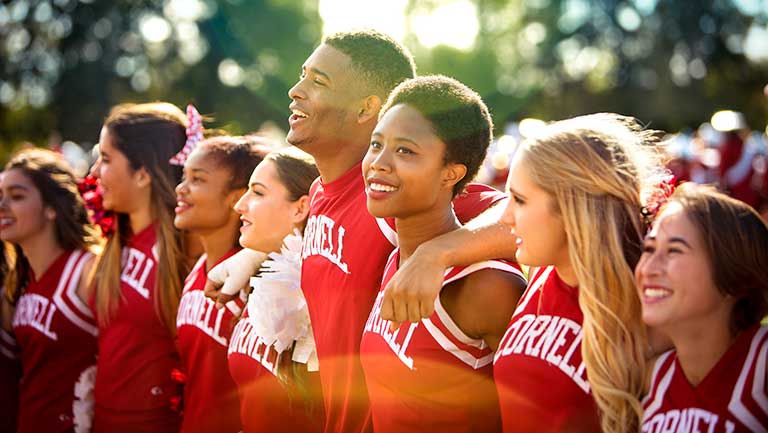 Cornell cheerleaders standing in a line